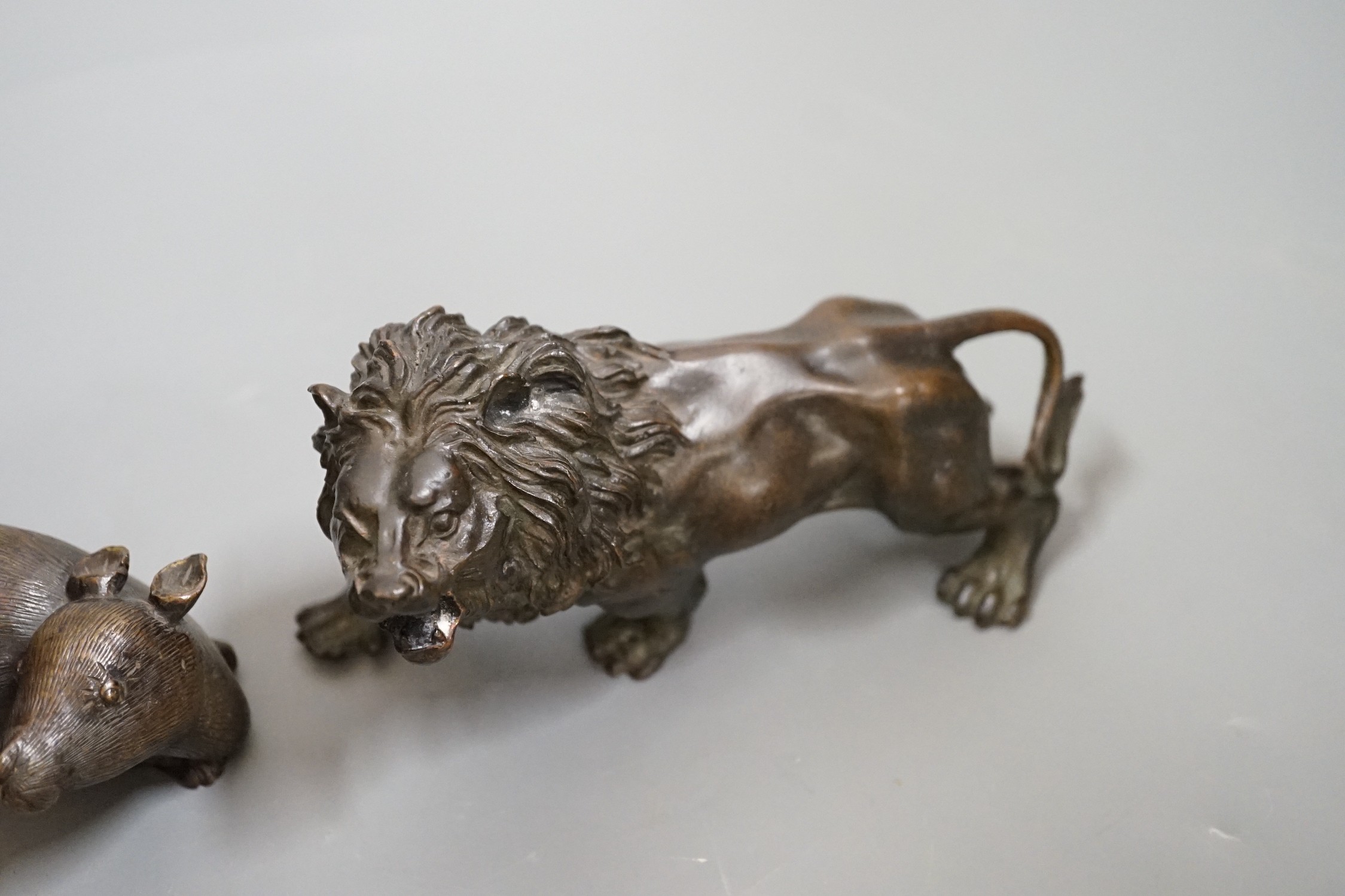 A bronze figure of a rat and another of a lion, 16cm wide